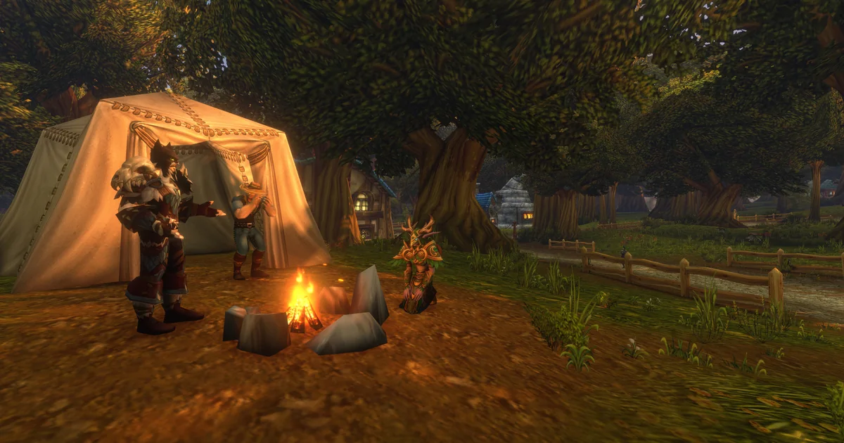 3 players around a campfire in Elwynn Forest in WoW Forever